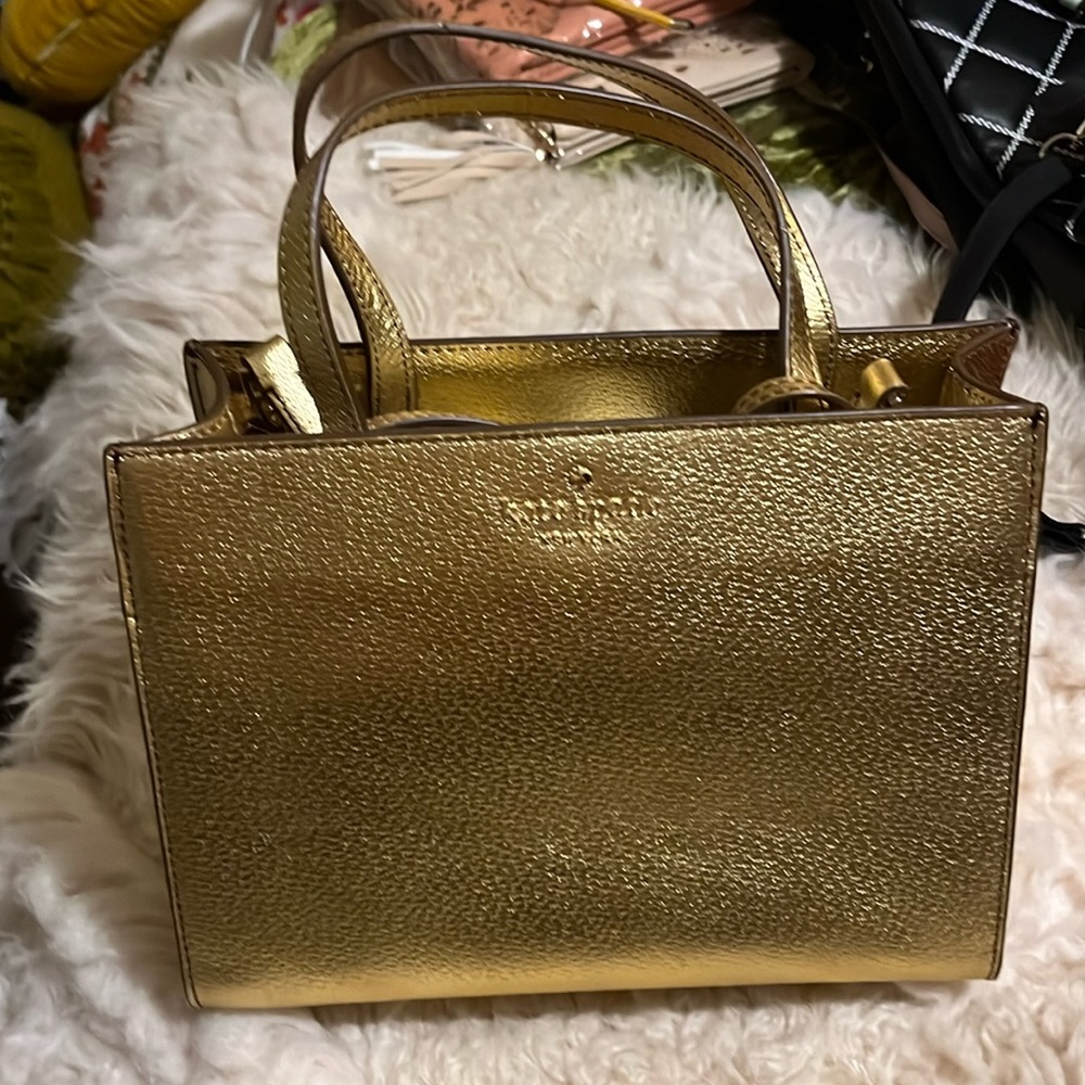 NWOT never been used dust bag included. Kate Spade New York. Cat Friendly home.